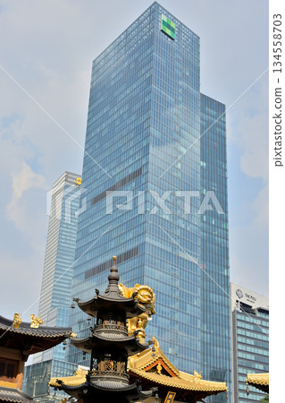 Historic Buddhist temple complex of Jingan Temple on the West Nanjing Road in downtown Shanghai, China Historic Buddhist temple complex of Jingan Temple on the West Nanjing Road in downtown Shanghai, China 134558703