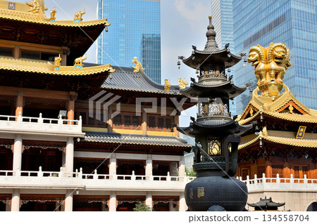 Historic Buddhist temple complex of Jingan Temple on the West Nanjing Road in downtown Shanghai, China 134558704