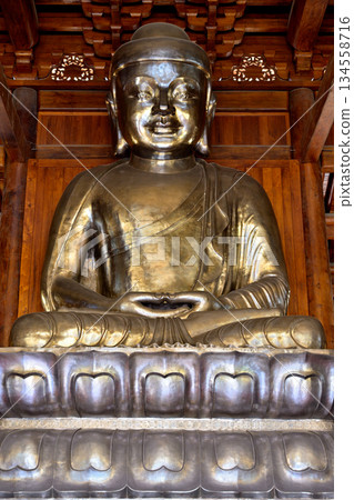 Buddha in historic Buddhist Jingan Temple on the West Nanjing Road in Shanghai, China Buddha in historic Buddhist Jingan Temple on the West Nanjing Road in Shanghai, China 134558716