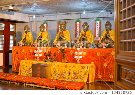 Buddhas in historic Buddhist Jingan Temple on the West Nanjing Road in downtown Shanghai, China Buddhas in historic Buddhist Jingan Temple on the West Nanjing Road in downtown Shanghai, China 134558726