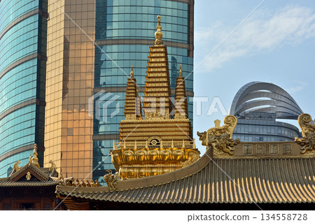 Historic Buddhist temple complex of Jingan Temple on the West Nanjing Road in downtown Shanghai, China Historic Buddhist temple complex of Jingan Temple on the West Nanjing Road in downtown Shanghai, China 134558728