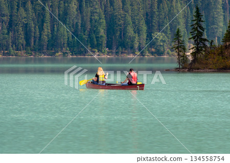 Tourists canoeing on Emerald Lake and the emerald green lake 134558754