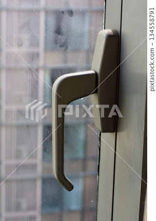Modern Window Handle with Urban Background Modern Window Handle with Urban Background 134558791