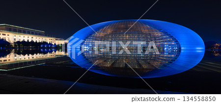 National Centre for the Performing Arts NCPA reflecting in the water at night in Beijing, China 134558850
