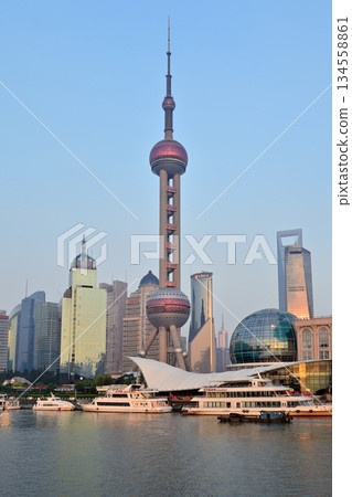 Cityscape view across Huangpu River of Oriental Pearl Tower and Pudong new area in Shanghai, China Cityscape view across Huangpu River of Oriental Pearl Tower and Pudong new area in Shanghai, China 134558861