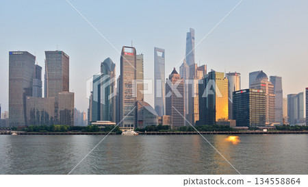 Cityscape sunset view across Huangpu River of skyscrapers in Pudong new area in Shanghai, China 134558864
