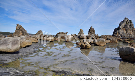 Hashigui Rocks natural stone formations in Kushimoto Town in Kii Peninsula in Wakayama, Japan 134558900