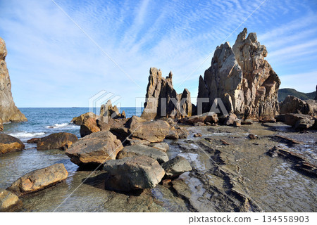 Hashigui Rocks natural stone formations in Kushimoto Town in Kii Peninsula in Wakayama, Japan Hashigui Rocks natural stone formations in Kushimoto Town in Kii Peninsula in Wakayama, Japan 134558903