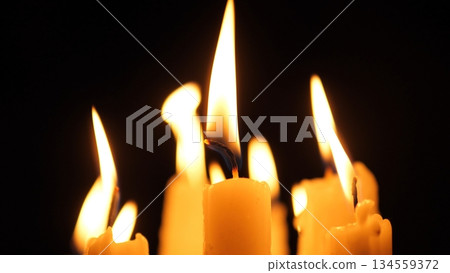 Candle Flames Ignite Shared Warmth, Flickering Candle Lights Symbolize Collective Comfort And Unity, Gathering Of Glowing Candles Signifies Communal Connection And Remembrance 134559372