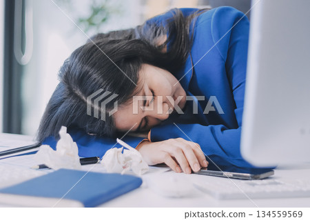 Business woman having headache at office 134559569