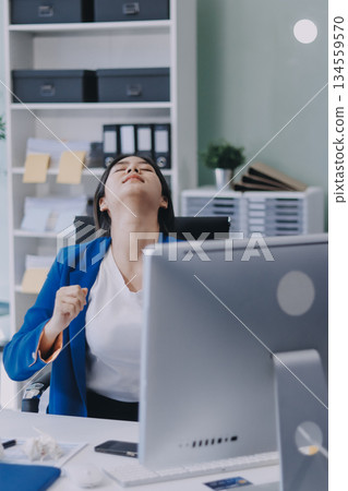 Asian women Aches from working She felt like relaxing Asian women Aches from working She felt like relaxing 134559570