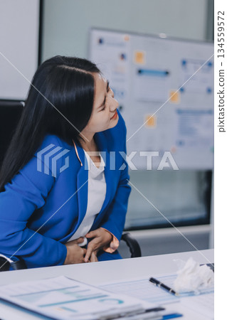 Asian women Aches from working She felt like relaxing Asian women Aches from working She felt like relaxing 134559572