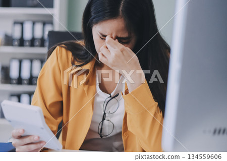 Headache, business woman at night and computer stress while working for a deadline with pc glitch. Sad corporate manager with anxiety about target working at desk screen late to complete task online Headache, business woman at night and computer stress while working for a deadline with pc glitch. Sad corporate manager with anxiety about target working at desk screen late to complete task online 134559606