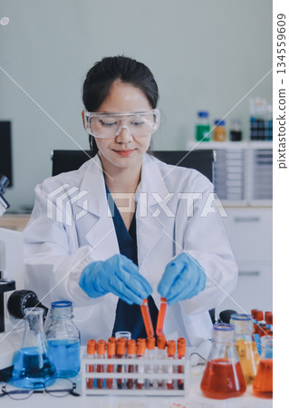 Portrait, science and happy woman on laptop in lab to research chemistry, test or innovation. Microscope, scientist and face of medical doctor in goggles for microbiology, healthcare or pharma study Portrait, science and happy woman on laptop in lab to research chemistry, test or innovation. Microscope, scientist and face of medical doctor in goggles for microbiology, healthcare or pharma study 134559609