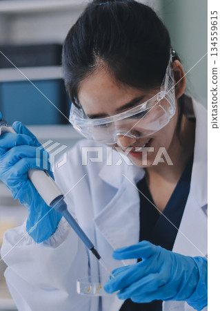 Portrait, science and happy woman on laptop in lab to research chemistry, test or innovation. Microscope, scientist and face of medical doctor in goggles for microbiology, healthcare or pharma study Portrait, science and happy woman on laptop in lab to research chemistry, test or innovation. Microscope, scientist and face of medical doctor in goggles for microbiology, healthcare or pharma study 134559615