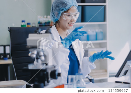 Portrait, science and happy woman on laptop in lab to research chemistry, test or innovation. Microscope, scientist and face of medical doctor in goggles for microbiology, healthcare or pharma study Portrait, science and happy woman on laptop in lab to research chemistry, test or innovation. Microscope, scientist and face of medical doctor in goggles for microbiology, healthcare or pharma study 134559637