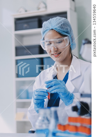 Portrait, science and happy woman on laptop in lab to research chemistry, test or innovation. Microscope, scientist and face of medical doctor in goggles for microbiology, healthcare or pharma study Portrait, science and happy woman on laptop in lab to research chemistry, test or innovation. Microscope, scientist and face of medical doctor in goggles for microbiology, healthcare or pharma study 134559640