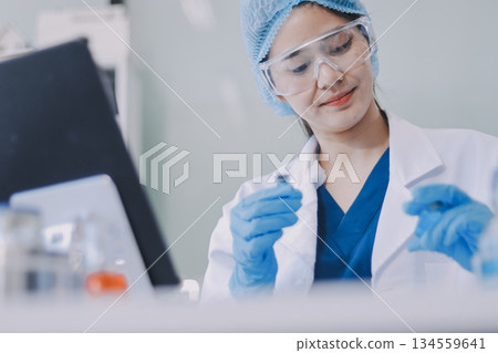 Portrait, science and happy woman on laptop in lab to research chemistry, test or innovation. Microscope, scientist and face of medical doctor in goggles for microbiology, healthcare or pharma study Portrait, science and happy woman on laptop in lab to research chemistry, test or innovation. Microscope, scientist and face of medical doctor in goggles for microbiology, healthcare or pharma study 134559641