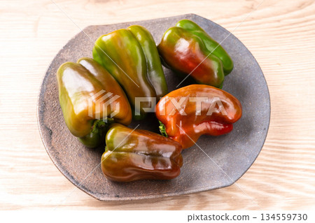 Red ripe peppers 134559730