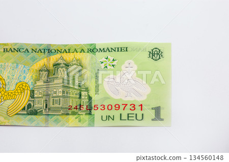 Romanian one leu banknote with architectural detail closeup on white. Romanian one leu banknote with architectural detail closeup on white. 134560148