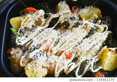 Steamed vegetables and cod with breadcrumbs and mayonnaise Steamed vegetables and cod with breadcrumbs and mayonnaise 134561174