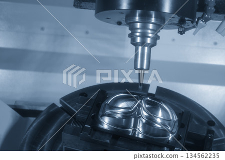 The 5-axis machining center cutting mold parts with solid barrel end mill tool in the light blue scene. The 5-axis machining center cutting mold parts with solid barrel end mill tool in the light blue scene. 134562235