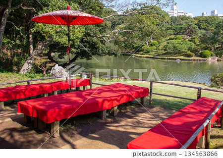 A view of the red carpet and Japanese umbrellas at the garden teahouse overlooking the pond at Rikugien Garden A view of the red carpet and Japanese umbrellas at the garden teahouse overlooking the pond at Rikugien Garden 134563866