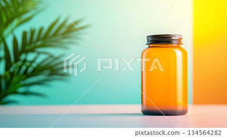 vibrant amber jar with metallic lid against colorful background vibrant amber jar with metallic lid against colorful background 134564282