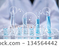 Laboratory research science chemistry blue liquid test tube with icon 134564442