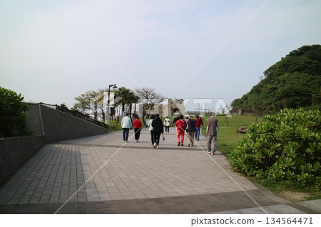 People walk along the paved path leading to Fort Santo Domingo. People walk along the paved path leading to Fort Santo Domingo. 134564471