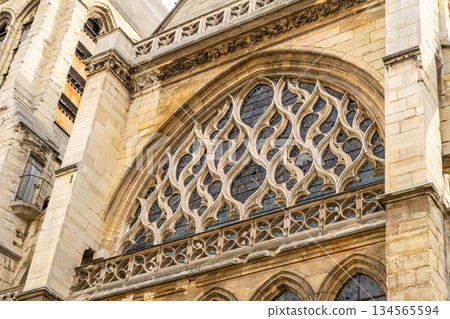 Flamboyant Gothic style in architecture detail building in Paris France Church of Saint Severin 13th century. Old window facade 134565594