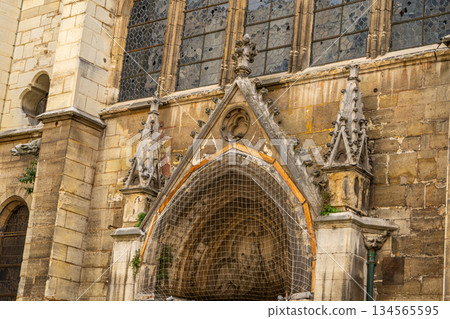 Flamboyant Gothic style in architecture building in Paris France Church of Saint Severin 13th century. Old door entrance arch facade 134565595