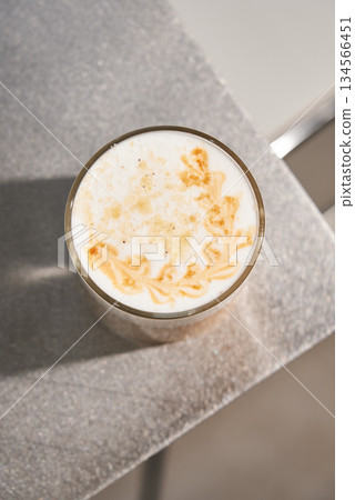 Stylish Caffeine Presentation With Intricate Flower Foam And Shimmering Gold Embellishments 134566451