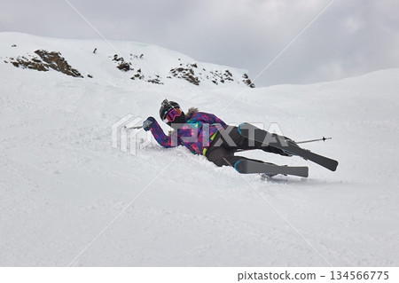 Skiing in the winter woman fallen over Skiing in the winter woman fallen over 134566775