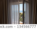 Apartment with sea view, open balcony door 134566777