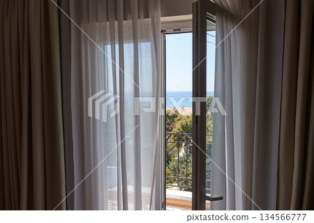 Apartment with sea view, open balcony door 134566777