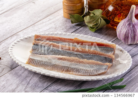 Marinated salted herring fillet slices 134566967