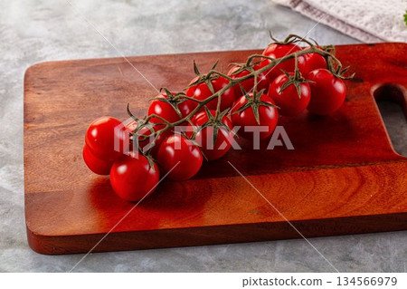 Ripe sweet cherry tomato branch 134566979
