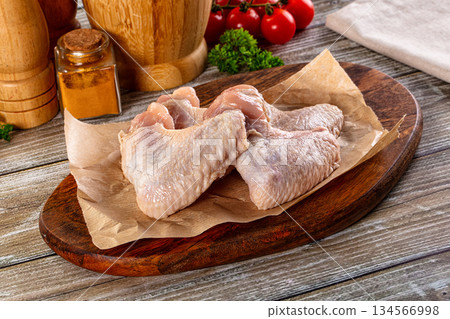 Fresh raw chicken wings over board Fresh raw chicken wings over board 134566998