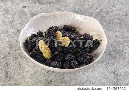 Ripe sweet juicy black and white mullberry 134567032