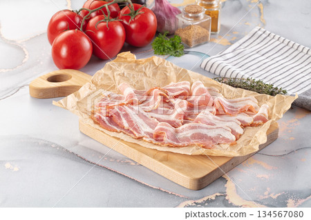 Sliced pork bacon over board Sliced pork bacon over board 134567080