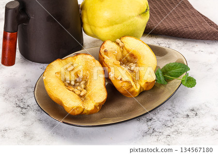 Baked quince with honey and cedar Baked quince with honey and cedar 134567180