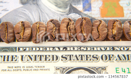 Macro image of coffee beans on a U.S. dollar, highlighting the banknote  134567837