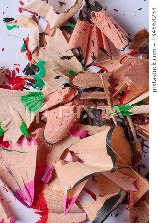 Close-up of a pile of spiral shavings from sharpening colored pencils on a white background Close-up of a pile of spiral shavings from sharpening colored pencils on a white background 134568233
