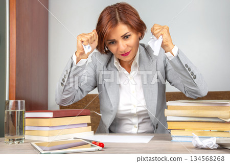 Business woman tired in the office and worried in emotions. Stress and headache 134568268