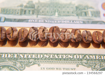 Roasted coffee beans placed on a U.S. dollar bill 134568297