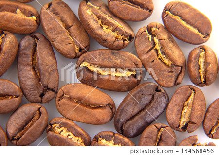 Close-up of roasted coffee beans with rich brown hues 134568456