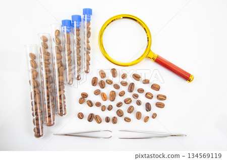 Scientific coffee inspection concept with magnifying glass Scientific coffee inspection concept with magnifying glass 134569119