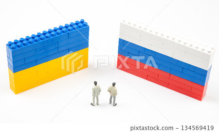 A creative scene with two blocks walls resembling the Ukrainian and Russian flags A creative scene with two blocks walls resembling the Ukrainian and Russian flags 134569419