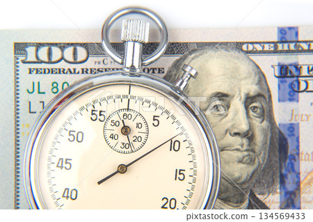 mechanical stopwatch on the background of dollars. Part time accuracy for business mechanical stopwatch on the background of dollars. Part time accuracy for business 134569433